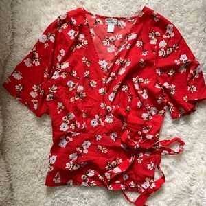 Red floral wrap top